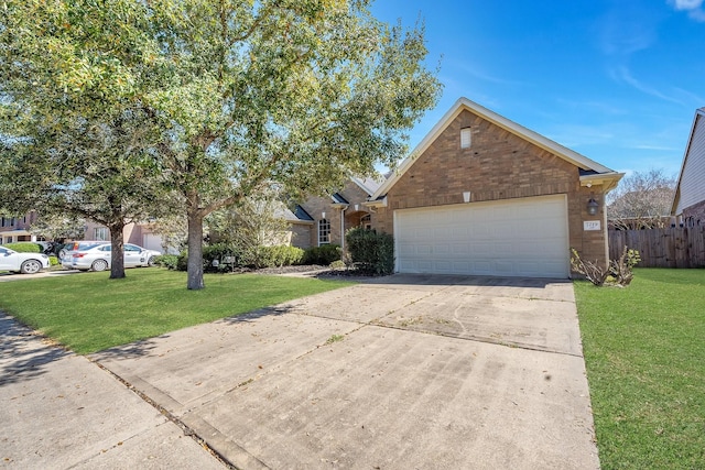 view of front facade with a garage, brick siding, fence, driveway, and a front lawn