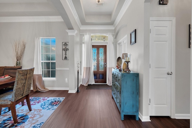 entrance foyer featuring dark wood-style floors, visible vents, plenty of natural light, and crown molding