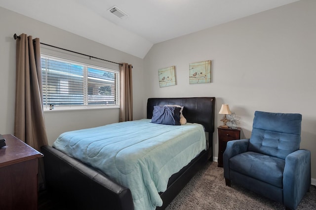 bedroom featuring lofted ceiling, visible vents, and carpet flooring