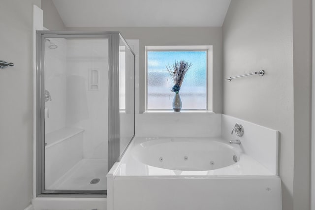 bathroom with a whirlpool tub and a stall shower