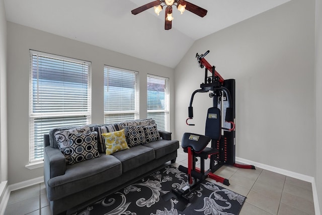 tiled living area with lofted ceiling, a ceiling fan, and baseboards