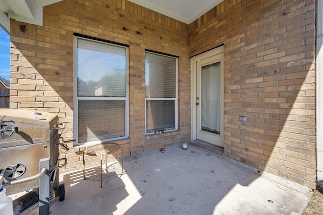 entrance to property with brick siding