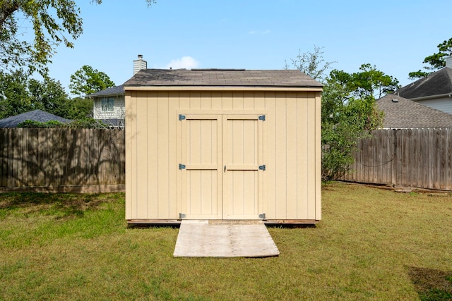 view of shed featuring a fenced backyard