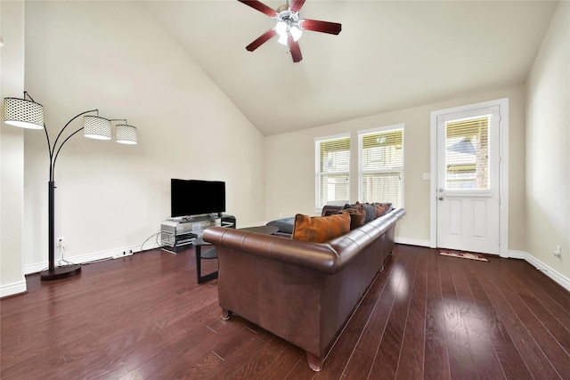 living room with high vaulted ceiling, dark wood finished floors, baseboards, and a ceiling fan