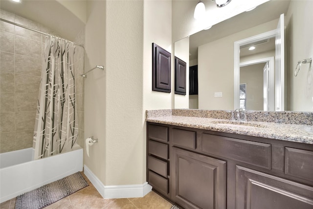 bathroom with shower / bathtub combination with curtain, tile patterned flooring, vanity, and baseboards