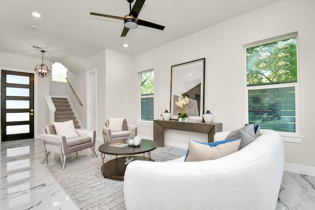 living area featuring marble finish floor, visible vents, baseboards, and recessed lighting