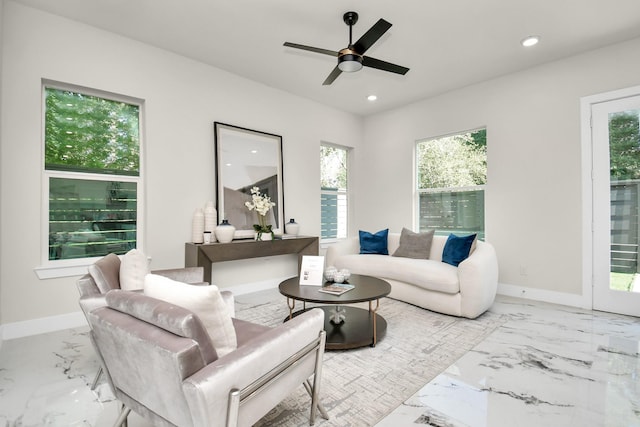 living room featuring baseboards, marble finish floor, ceiling fan, and recessed lighting