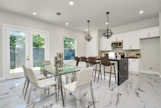 dining area featuring marble finish floor, visible vents, and recessed lighting