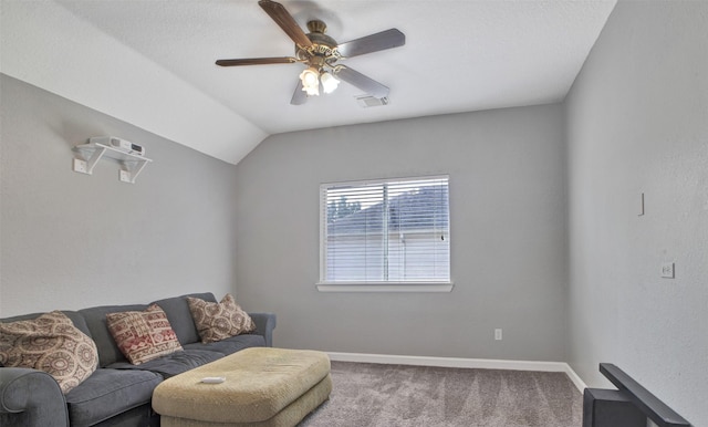 living room featuring ceiling fan, carpet floors, lofted ceiling, and baseboards