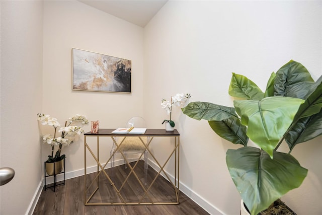 home office featuring baseboards and wood finished floors