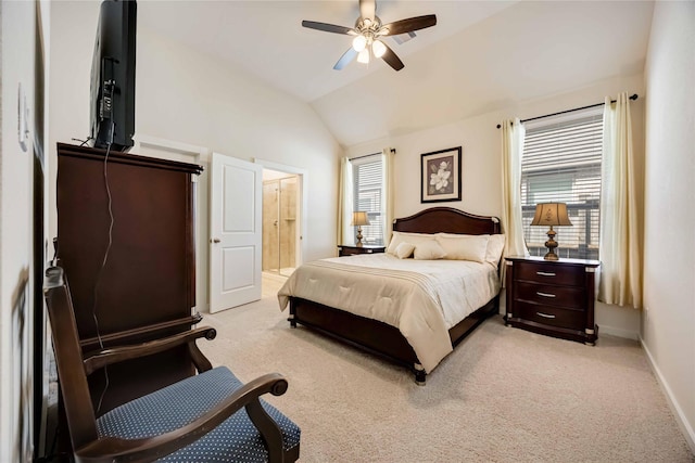 bedroom featuring lofted ceiling, a ceiling fan, light carpet, connected bathroom, and baseboards