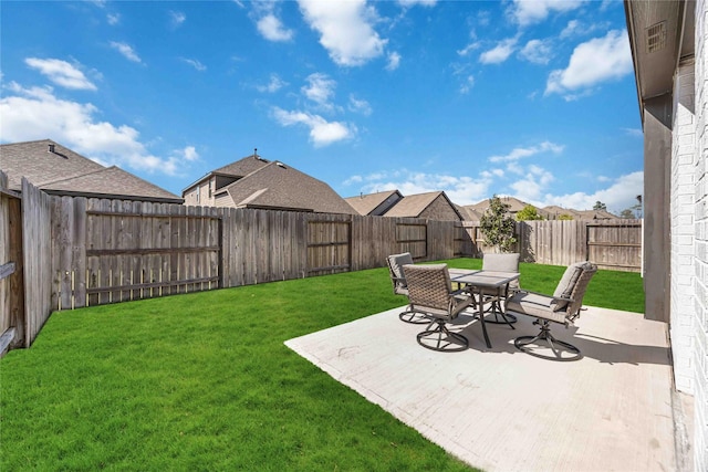 view of yard featuring a patio area and a fenced backyard