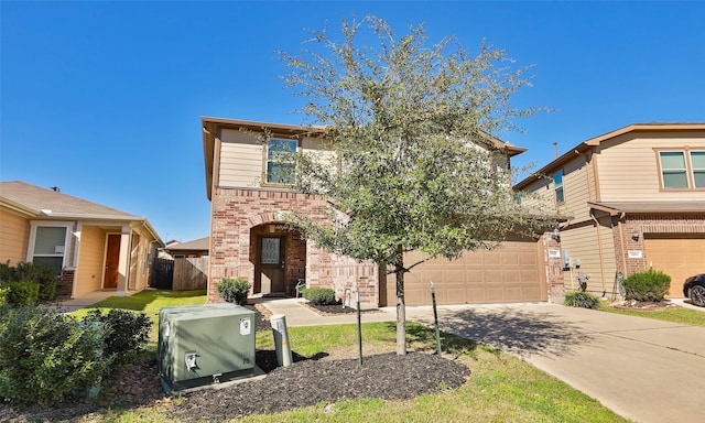 view of front of property with an attached garage, driveway, fence, and brick siding