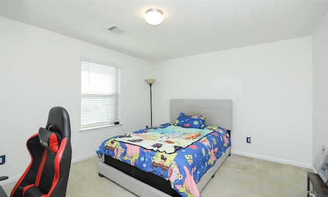 bedroom featuring baseboards, visible vents, and carpet flooring