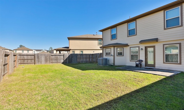 back of property featuring a patio area, a fenced backyard, central AC unit, and a lawn