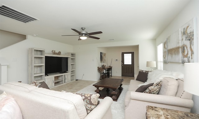 living room with ceiling fan and visible vents