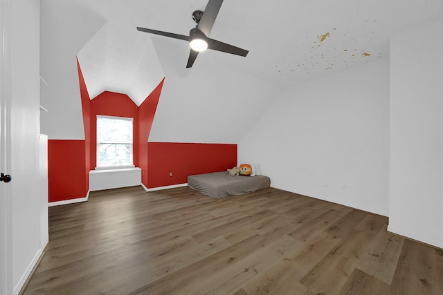 bonus room with lofted ceiling, ceiling fan, and wood finished floors