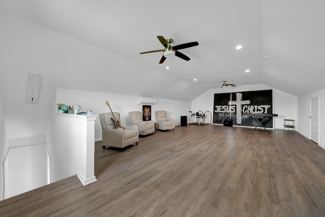 sitting room with a ceiling fan, lofted ceiling, wood finished floors, an upstairs landing, and recessed lighting