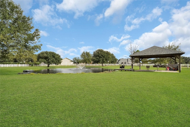 view of yard featuring fence and a gazebo