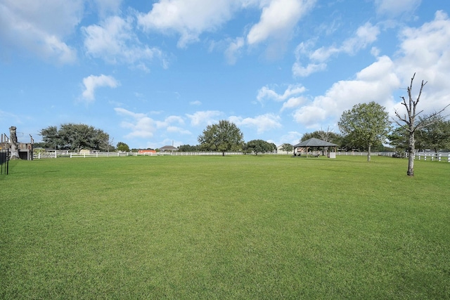 view of yard with fence and a gazebo