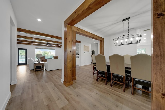 dining room with baseboards, light wood finished floors, beamed ceiling, and recessed lighting