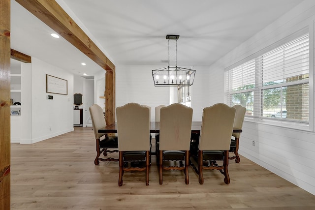 dining space featuring light wood-type flooring, beamed ceiling, recessed lighting, and an inviting chandelier