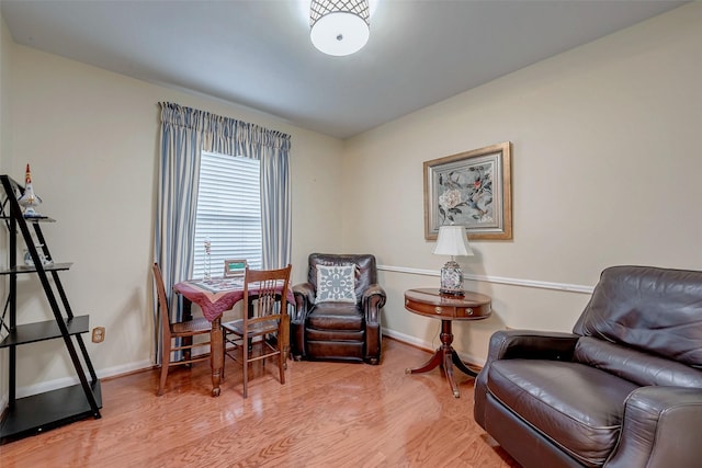 sitting room featuring light wood-style floors and baseboards