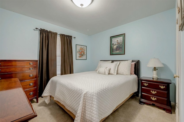 bedroom featuring carpet