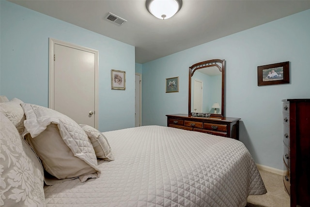 carpeted bedroom featuring visible vents and baseboards