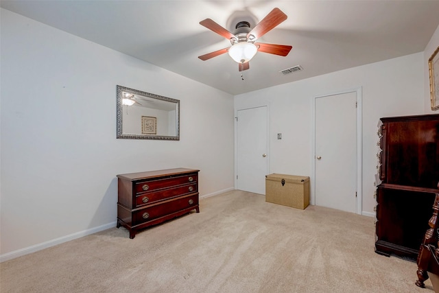 bedroom with carpet floors, visible vents, ceiling fan, and baseboards