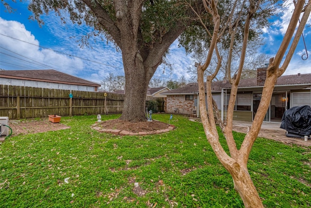 view of yard featuring a patio area and fence