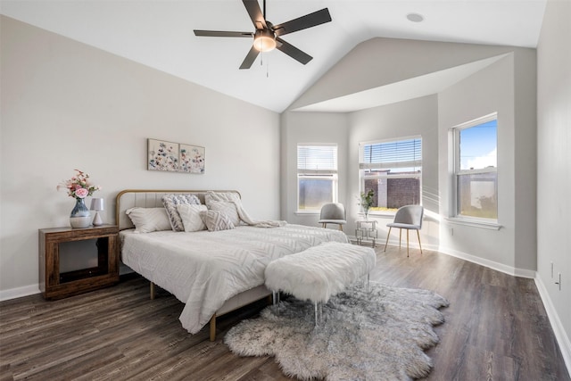 bedroom with vaulted ceiling, baseboards, dark wood finished floors, and a ceiling fan