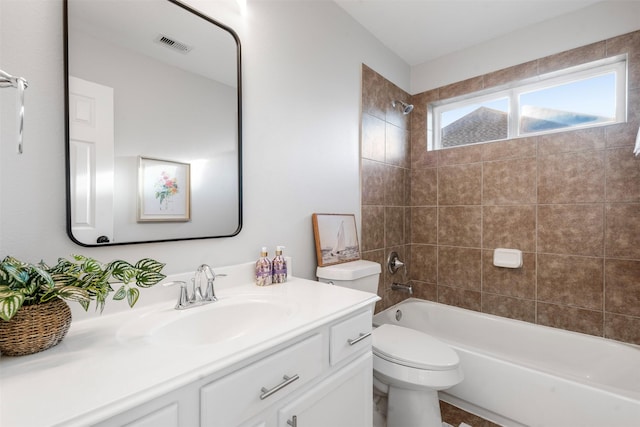 full bathroom featuring bathtub / shower combination, visible vents, vanity, and toilet