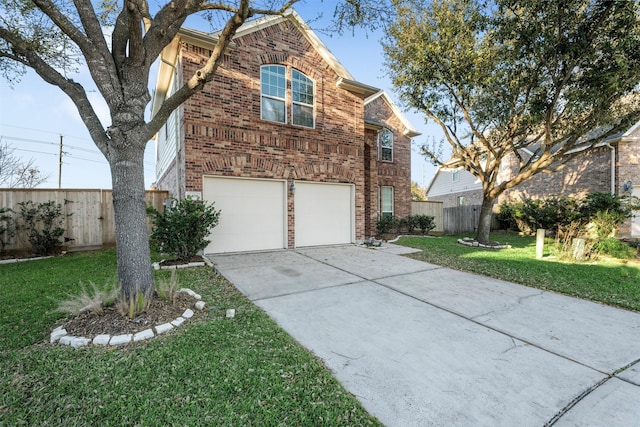 traditional-style house with brick siding, an attached garage, fence, driveway, and a front lawn