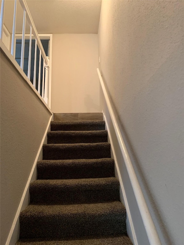 stairs with a textured wall