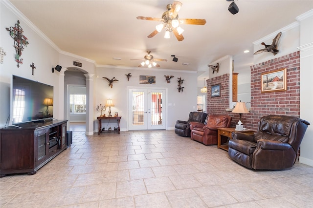 living area with baseboards, french doors, a ceiling fan, and crown molding