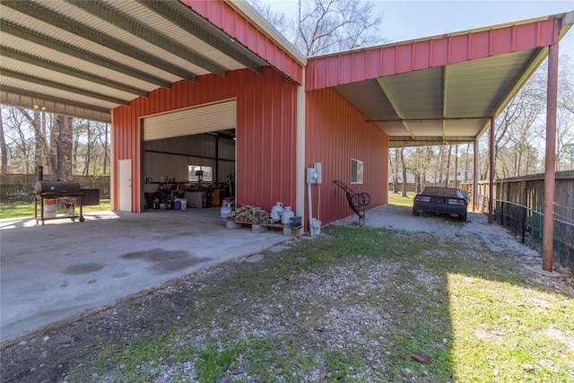 exterior space featuring fence and driveway