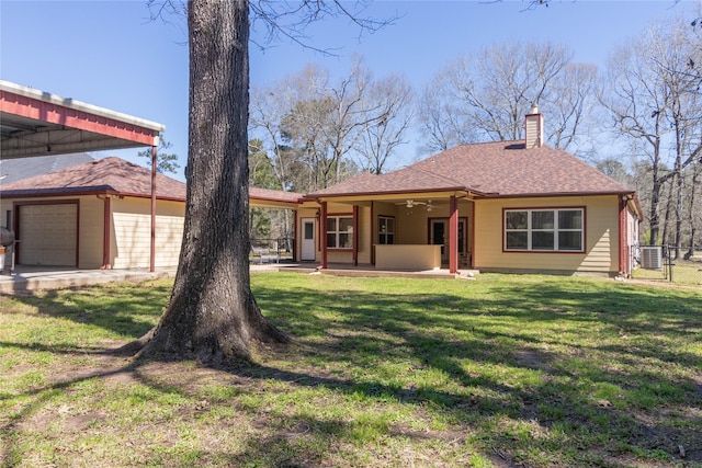 back of house featuring a patio, fence, a ceiling fan, a yard, and a chimney