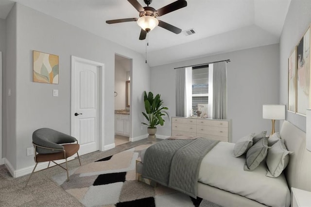 bedroom featuring light carpet, ensuite bath, visible vents, and baseboards