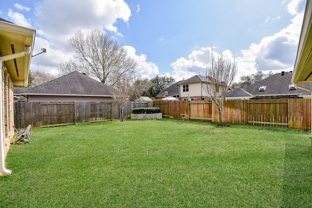 view of yard featuring a fenced backyard