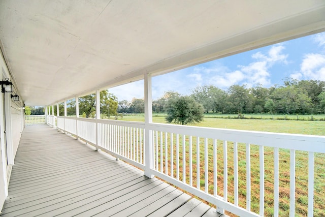 wooden terrace with a yard