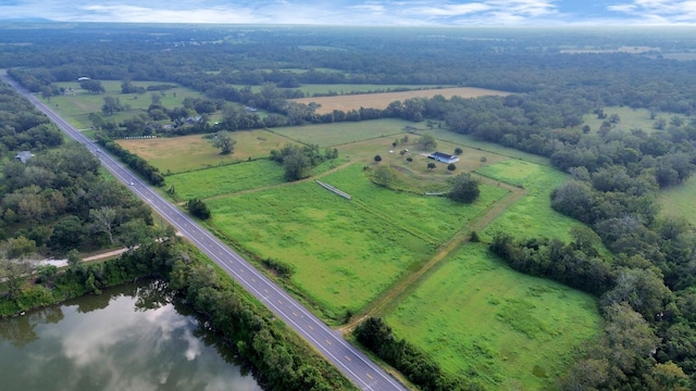 drone / aerial view with a rural view and a water view