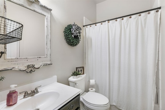 bathroom with vanity, toilet, and a shower with curtain