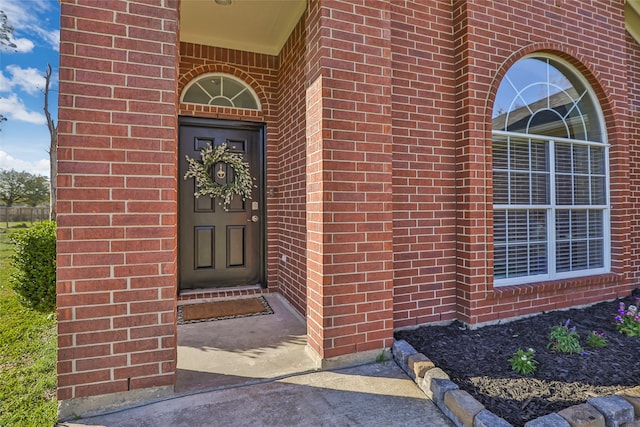 entrance to property with brick siding