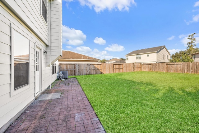 view of yard featuring a patio area and a fenced backyard