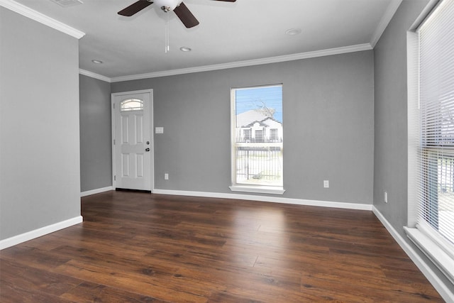 entrance foyer with crown molding, baseboards, and wood finished floors