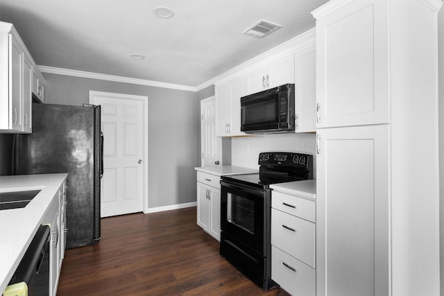 kitchen with dark wood finished floors, light countertops, visible vents, white cabinetry, and black appliances