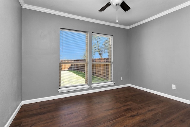 unfurnished room with ceiling fan, ornamental molding, dark wood-style flooring, and baseboards