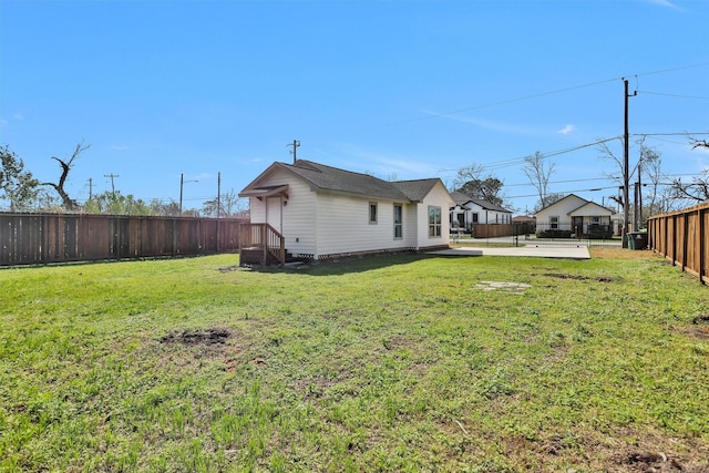 view of yard with a fenced backyard