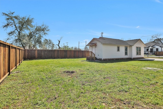 view of yard with a fenced backyard